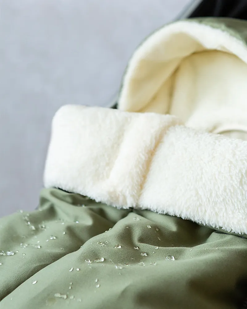 nobodinoz-winter-sleeping-bag-for-universal-baby-on-the-go-stroller-oekotex-extra-soft-eco-fur-olive-green-footmuffs_111345_zoom.webp